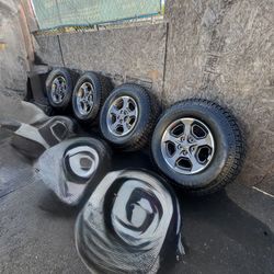 OEM Jeep 17 Inch Wheels with Falken Wildpeak A/T4W LT285/70R17 Tires Set of 4