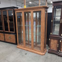 Oak Finish Three-Door China Cabinet with Crown Molding
