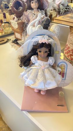 Porcelain mini doll