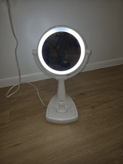 Mirror with light and plugs in
