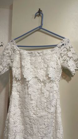 Hermoso vestido blanco de largo  a bajito de la Rodilla
