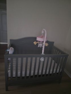 Crib with mobile and lullabytoy