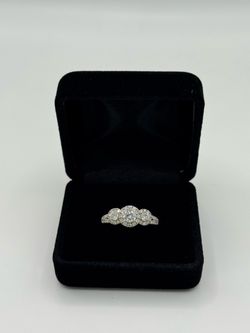 Ladies 14KT White Gold Three-Stone Diamond Halo Ring
