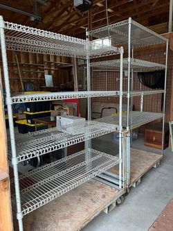 Two garage shelving units on wheels