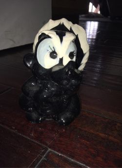 Porcelain collectible Disney skunk flower