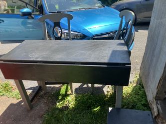 Bar or island drop leaf table with two chairs .