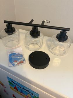Black vanity, light W clear, glass shades