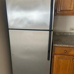 GE fridge with top freezer and ice maker 28 x 64