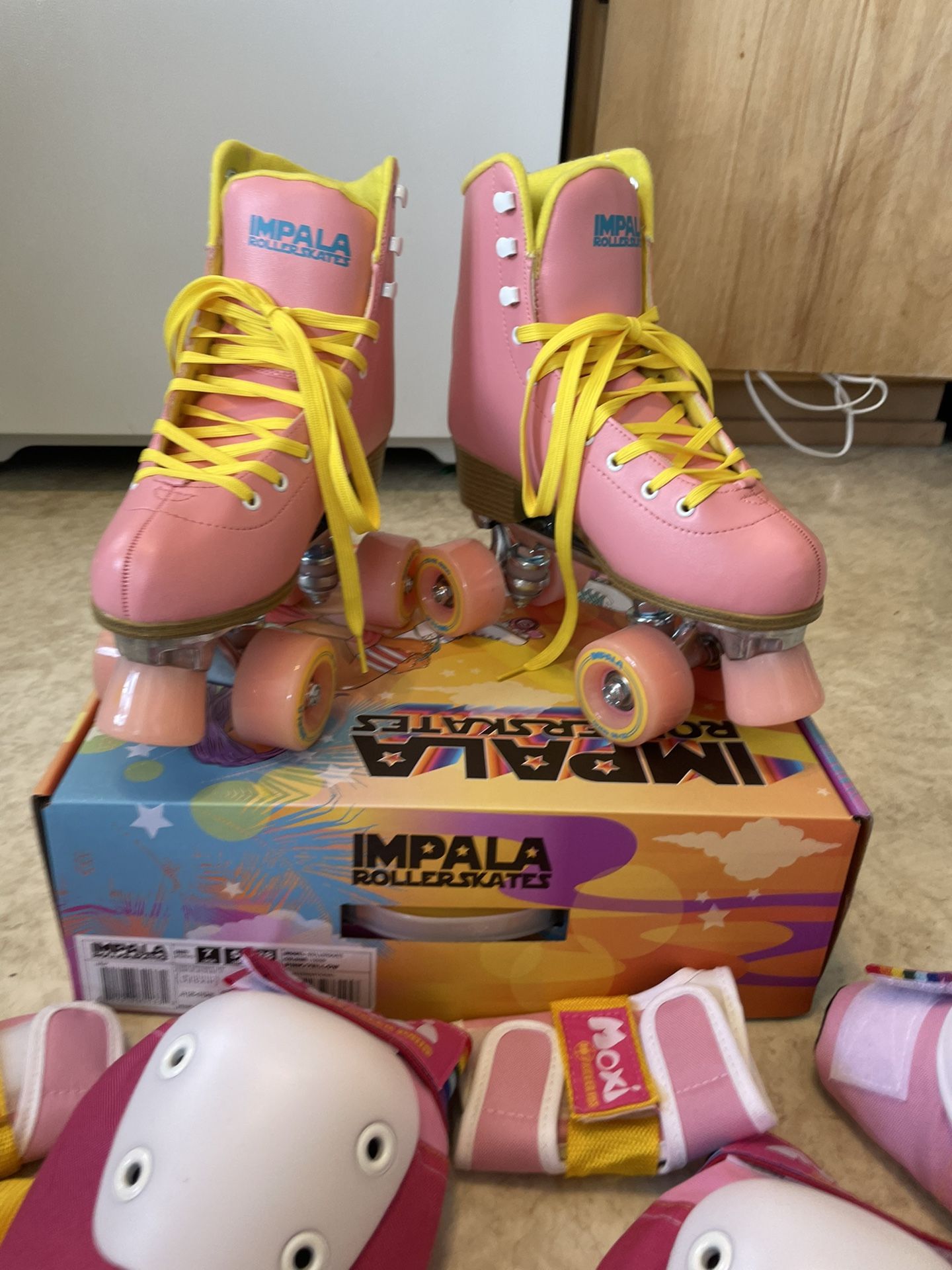 DOLLS KILL IMPALA ROLLER SKATES AND MOXI PADS