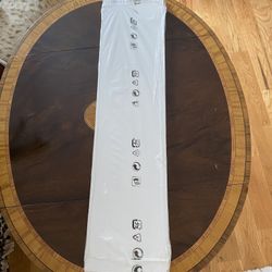 White wooden shelf. New. Never used. Still sealed in original packaging. 31.1/8 x 7.1/2 x 3/4 in.