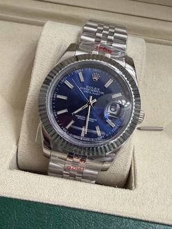 Rolex Oyster Perpetual Datejust 41 with a blue dial, fluted bezel, and Jubilee bracelet