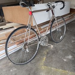 Vintage Centurion road bicycle with a metallic gold frame.