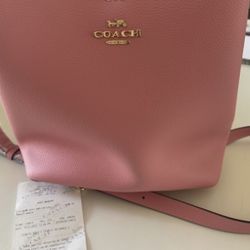 Coach Leather Bucket Bag. Brand New w/ Tags. Bubblegum. Approx. 10” x 10” x 5”.