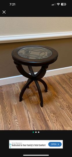 Side Table With Glass Top And A Wrought Iron Design 