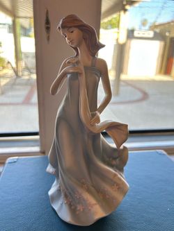 Porcelain Woman Figurine in Flowing Dress