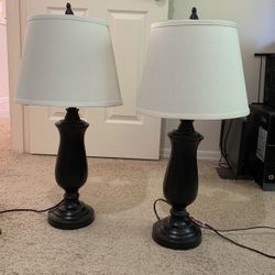 a pair table lamp in brozen finish with off-white shade