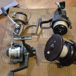 Four fishing reels. head browning zebco and mitchell