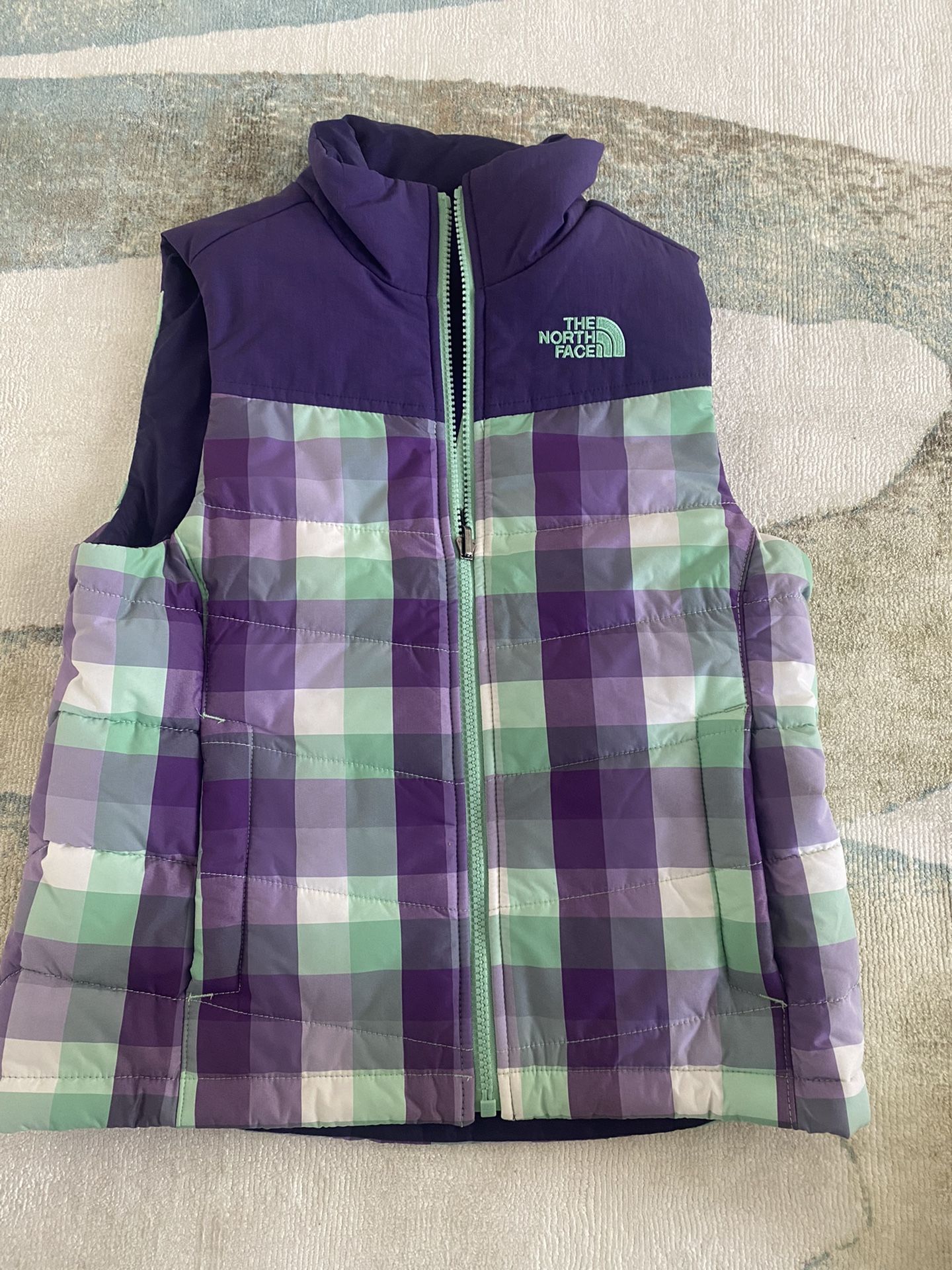 The North Face Girl's Purple Plaid Puffer Vest Size Small (7/8) S/P. Grey condition, make an offer!
