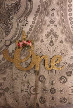 Unicorn themed cake topped first birthday