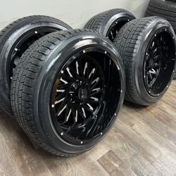 NEW 22x12 gloss black/milled wheels wrapped in 285/45r22 tires