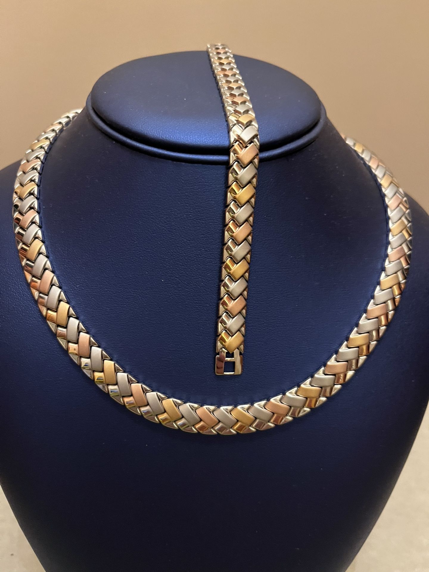 Brand new Jewelry set. This is a tri-color herringbone braided chain necklace and bracelet.  Tri-color bracelet features a yellow gold, rose gold, and