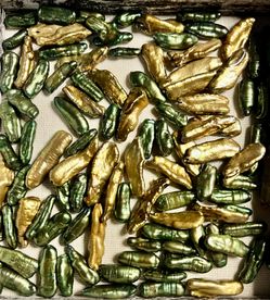 Home Accents decorative pearl bead accents in green and gold. Adds elegant shimmer and texture to vases, bowls, or craft projects. Lightweight pieces