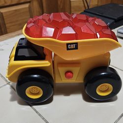 Catepillar Light Up Rumbling Dump Truck By Toy State. Truck Sounds, Lights Up, And Moves 