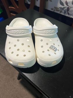 White Crocs Classic clogs with ventilation holes, size 7 M / 9 W