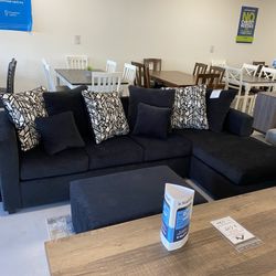 Black Sectional With Designed Pillows 