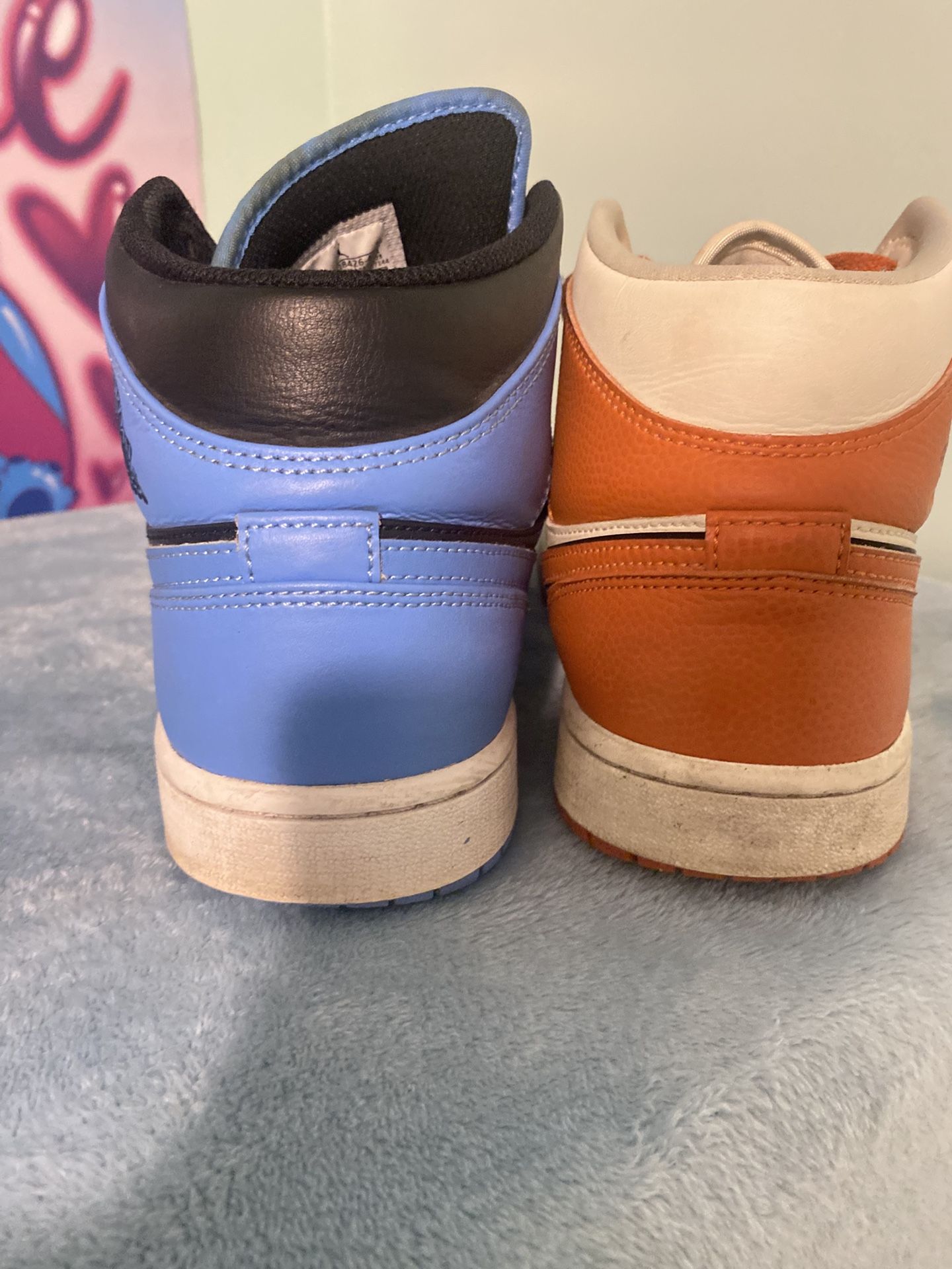 Nike Air Jordan 1 Mid SE in a "Coconut Milk/Sport Spice-Black" colorway and Air Jordan 1 Mid University Blue Black