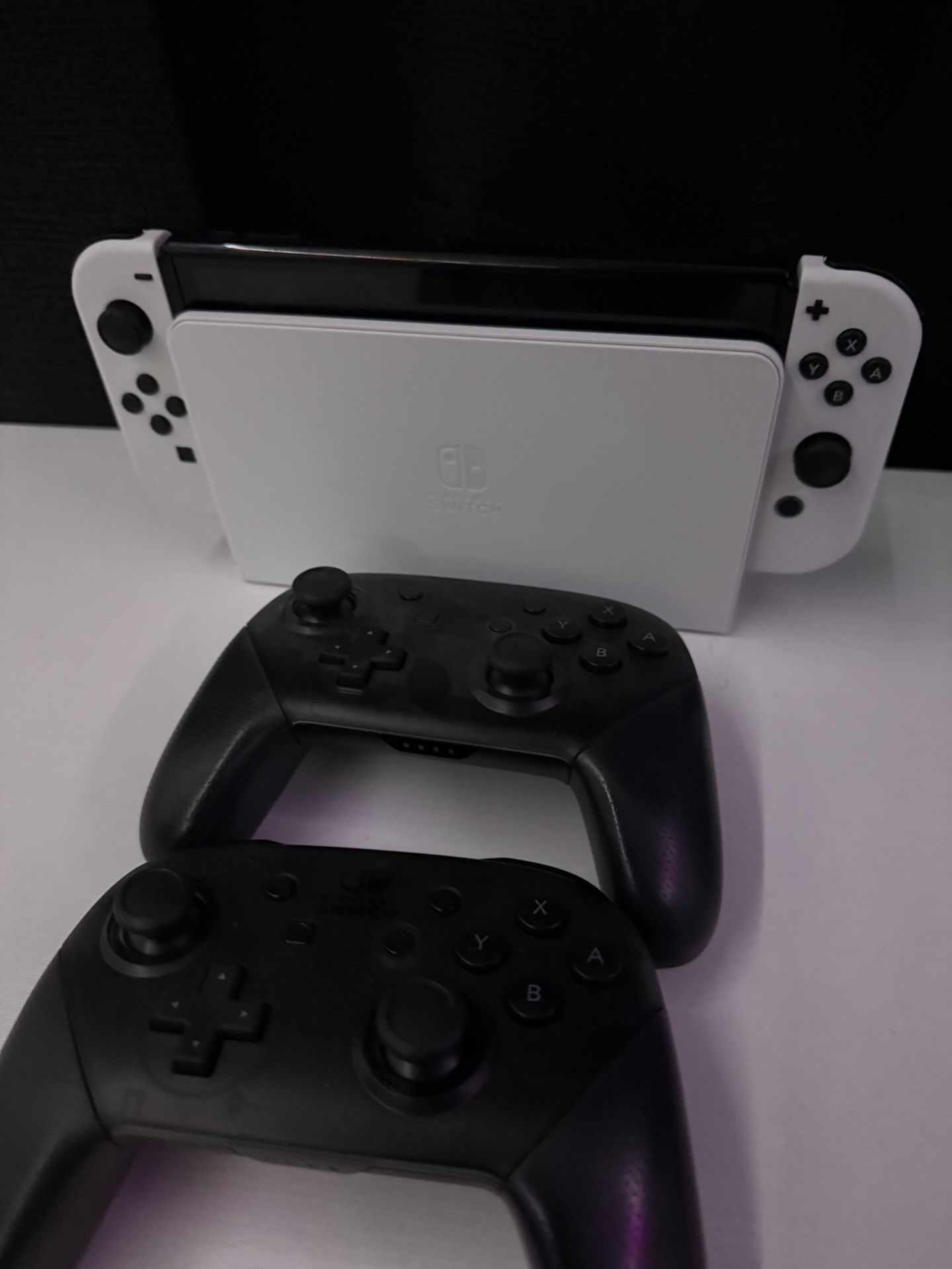 Nintendo Switch OLED with 2 Pro Controllers and SD card