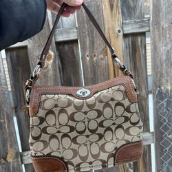 coach turn lock bag 
