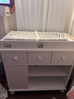 White changing table and dekor diaper pail