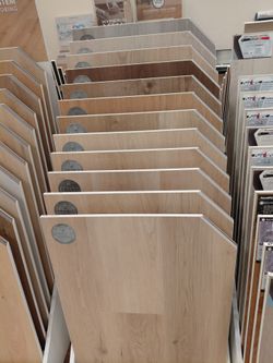 Vinyl plank with attached padding 20 mil wear layer