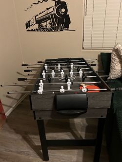 4-in-1 mini air hockey, foosball, billiards and table tennis