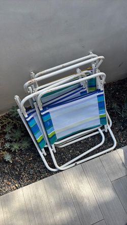 4 beach chairs and beach umbrella