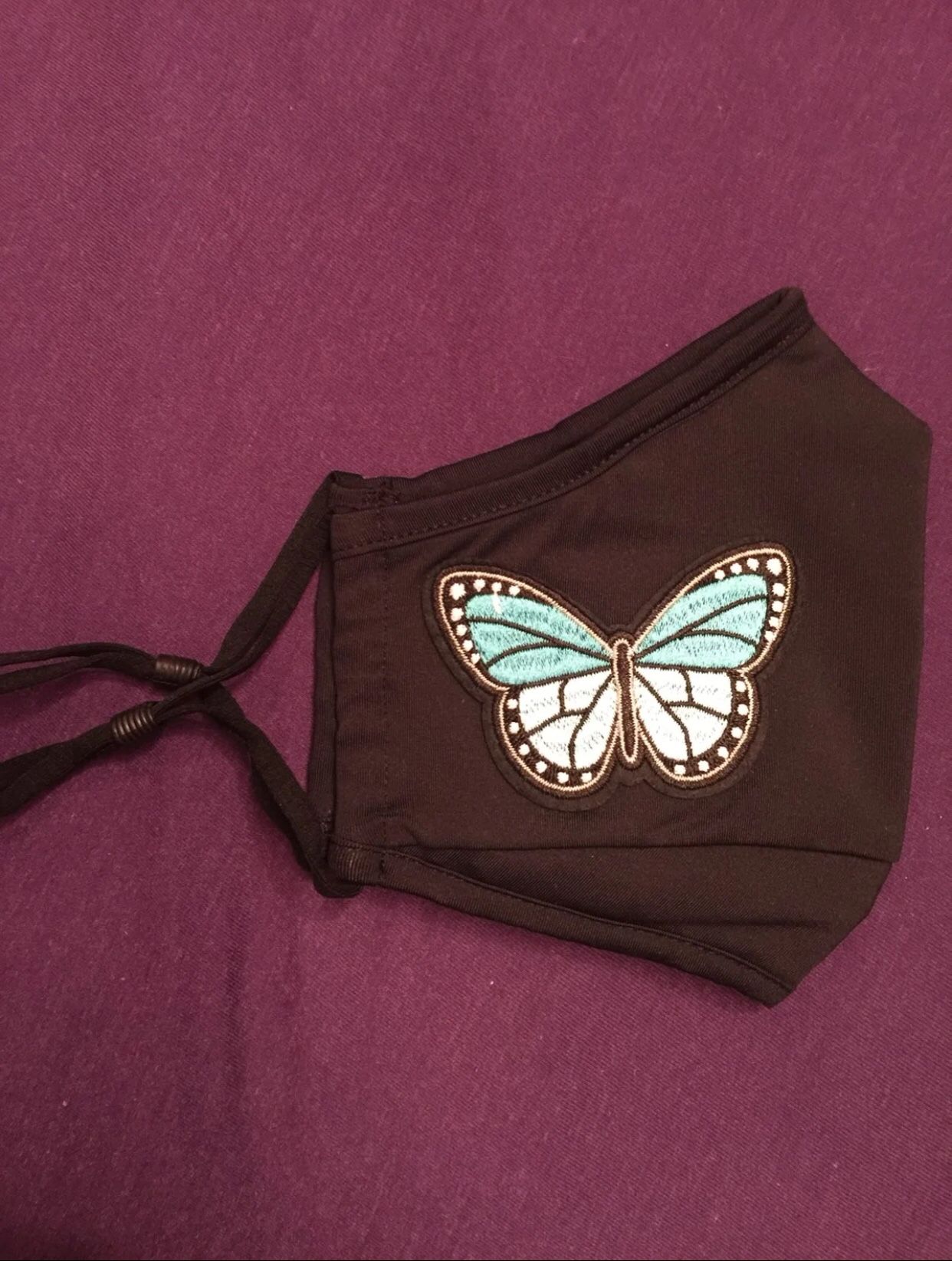 Tommie Copper face mask w/ simple butterfly patch