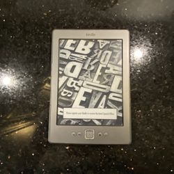 Amazon Kindle 4th Generation 2GB 7” WiFi Model D01100 with Charging Cable