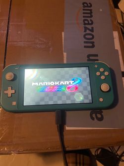 Nintendo Switch Lite Turquoise with mario kart deluxe