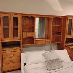 Headboard for Queen bed with tall cabinets, glass doors, shelves, and hidden compartment