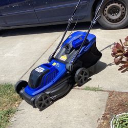 BADGER for the world battery operator lawnmower brand new never been used charger is include