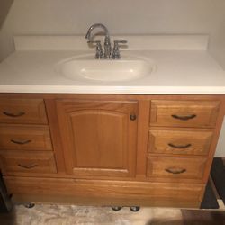48” Oak Vanity With Solid Surface Top And Faucet