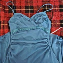 Blue prom dress with beaded details and ruched bodice.