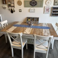 Wooden table with four chairs