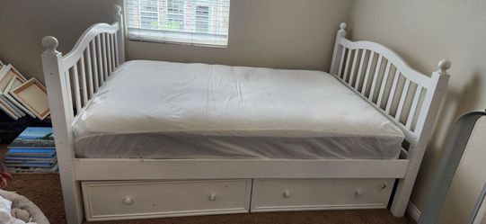 White full size bed frame with drawers and mattress