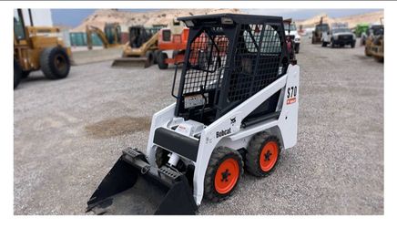 Bobcat S70 with dump trailer included