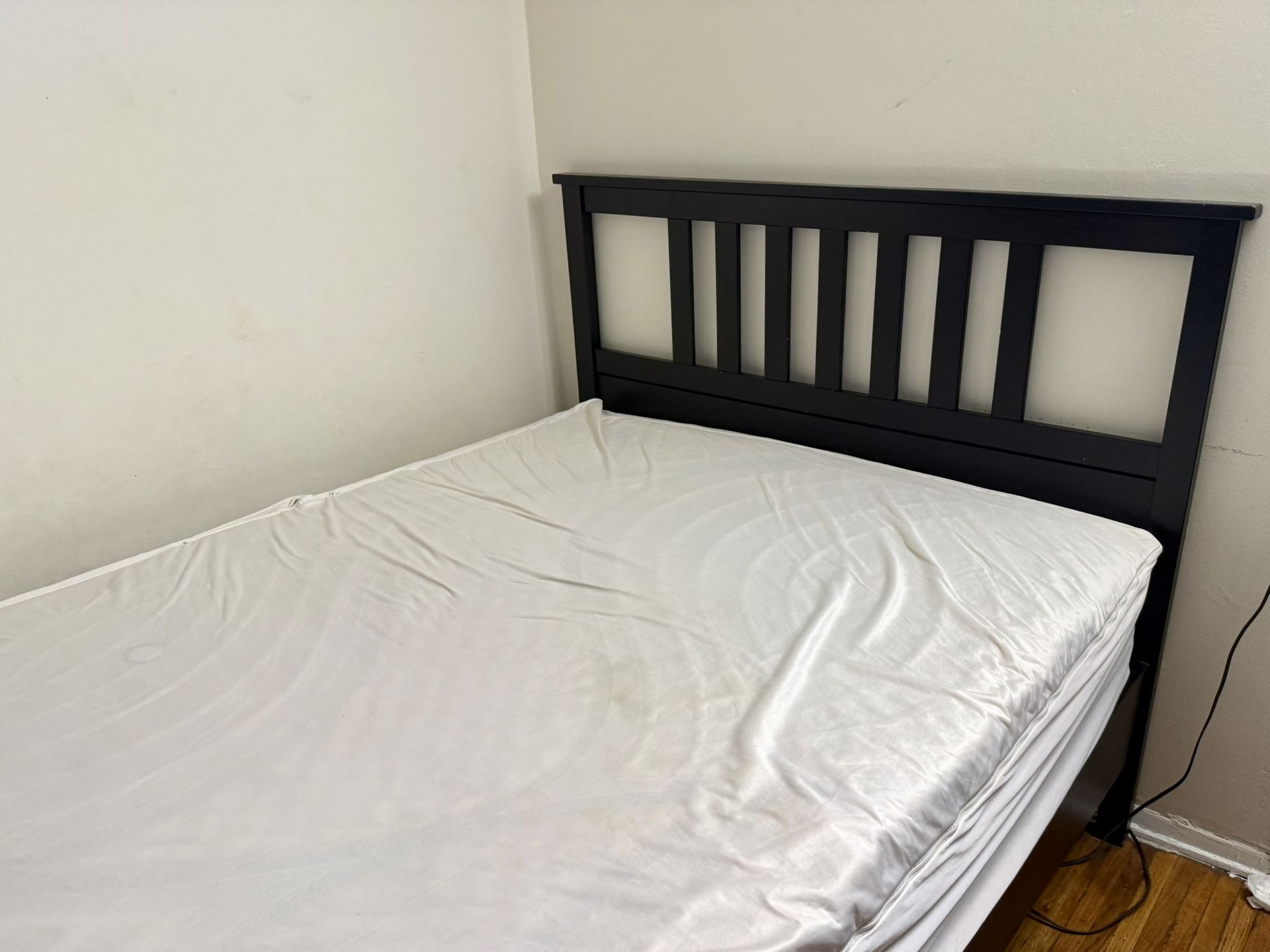 Hemnes IKEA full size bed with Hybrid mattress in protective cover