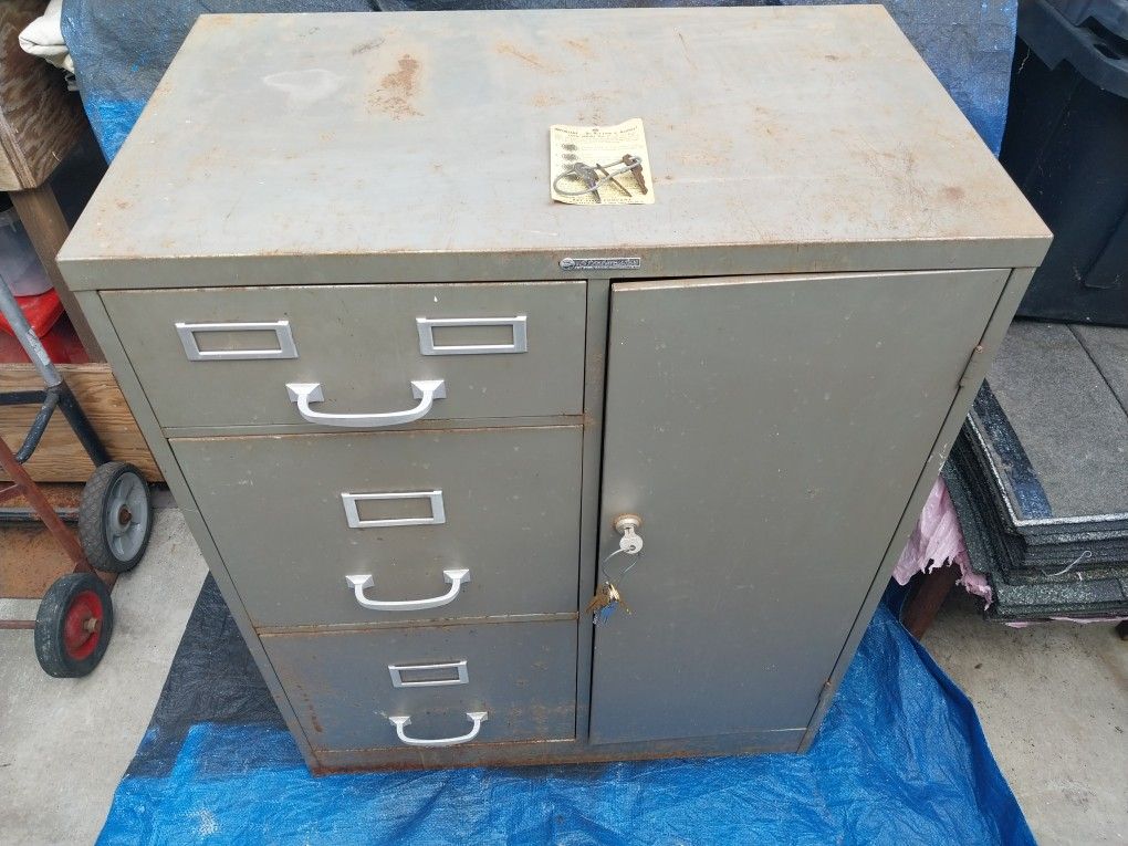 Vintage old file cabinet with safe combination.