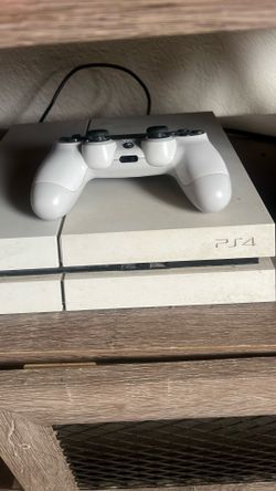 PS4 + 2 Controllers Comes With A Few Games
