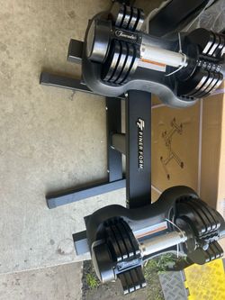 New pair of 25 pounds adjustable dumbbells they come with a rack